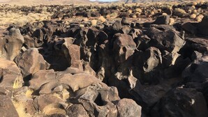 A rocky landscape with large boulders and sparse vegetation. - Olancha Lakeside Camping RV Site#2 Near Mt. Whitney (Olancha)