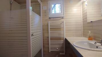 Shower, hair dryer, soap, toilet paper