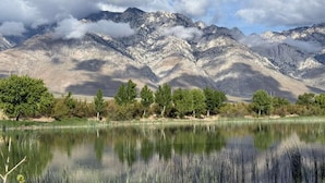 A mountain landscape with a lake in the foreground and a clear sky. - Death Valley Passageway Lake Olancha RV Campsite#4 (Olancha)