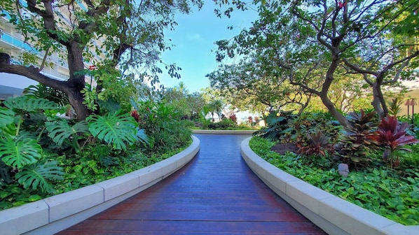Stroll through lush gardens to a serene outdoor space.
