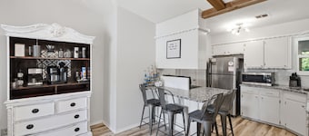 Charming 3BR retreat with a coffee lover's dream setup, fenced backyard, patio, and all the comforts of home.