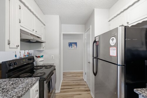 Charming 3BR retreat with a coffee lover's dream setup, fenced backyard, patio, and all the comforts of home.