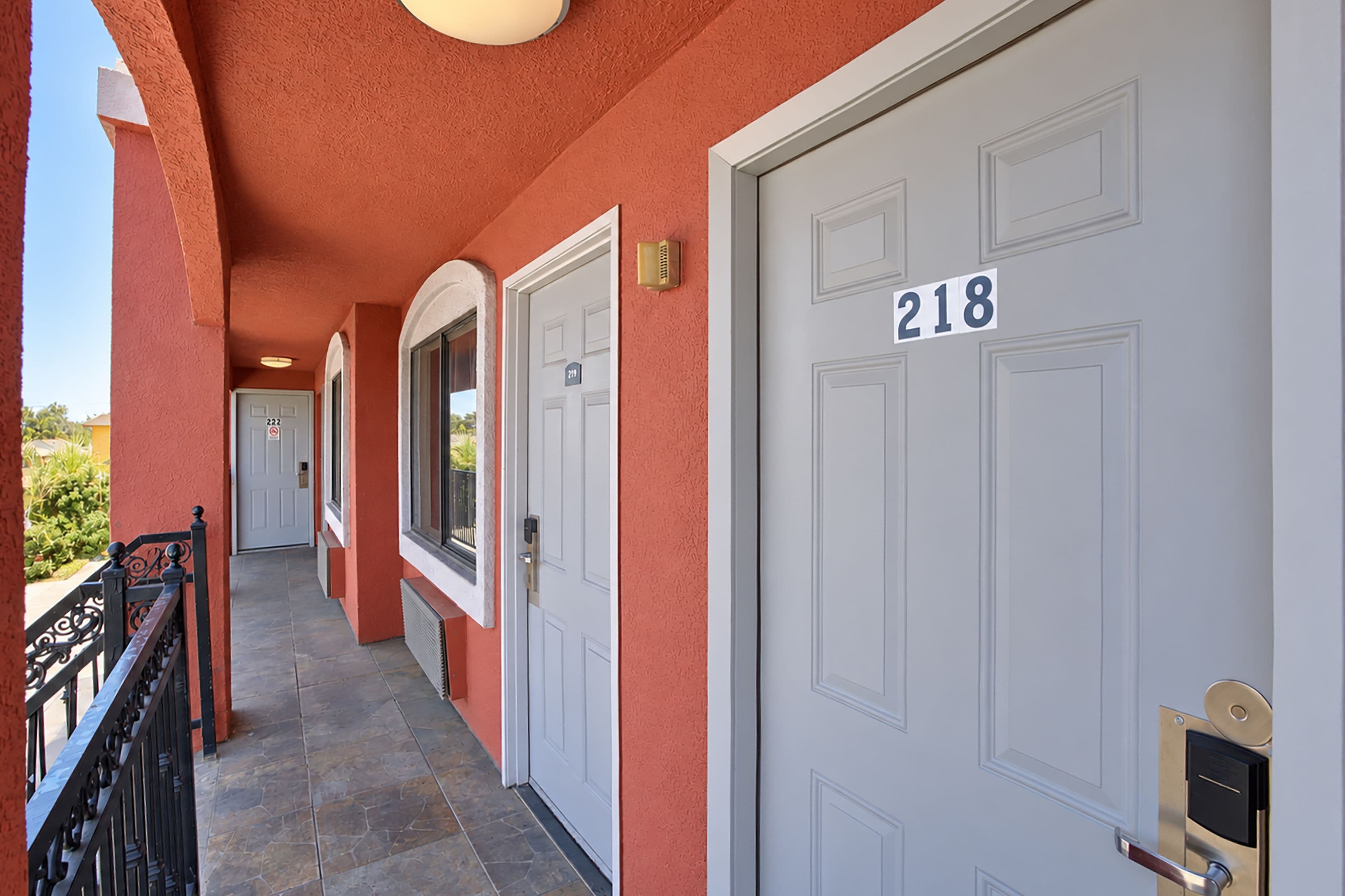 A corridor with doors numbered 218 and 222, leading to individual rooms.