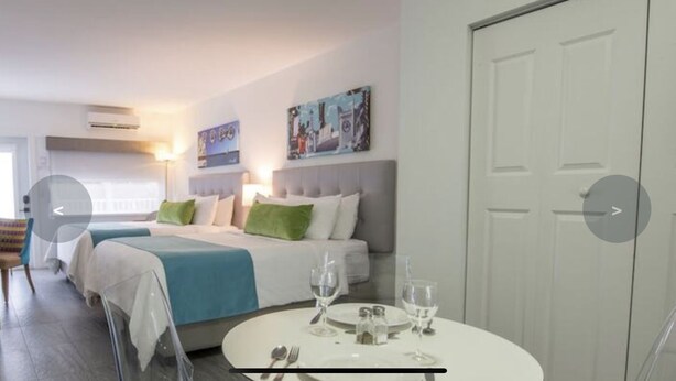 Junior Studio Suite | Living area | 24-inch flat-screen TV with cable channels, TV - Royal1 (Kissimmee)