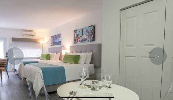 Junior Studio Suite | Living area | 24-inch flat-screen TV with cable channels, TV