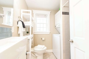 Shower, hair dryer, towels, shampoo