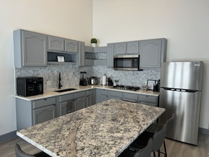 Fridge, microwave, stovetop, coffee/tea maker