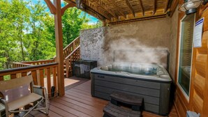 A hot tub on a wooden deck with a wooden railing and a bench. - A Cloud 9 - Mountain Views, Hot Tub Bliss & Pool Table Fun! (Sevierville)