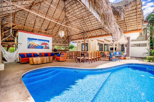 Airy oasis with a grand outdoor space, private pool, & shared tennis court