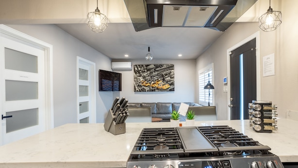 A modern kitchen with a central island, stainless steel appliances, and pendant lighting. - NEWLY Renovated 2bed/1bath home! (Los Angeles)