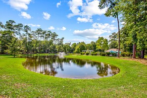 Property grounds - Secluded golf course front condo with porch, pool, tennis, hot tub, gym, & AC (North Myrtle Beach)