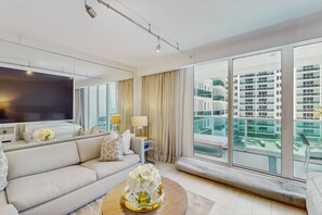 TV - Deluxe beachfront condo with ocean views, pools, spas, gym, & valet parking (Miami Beach)