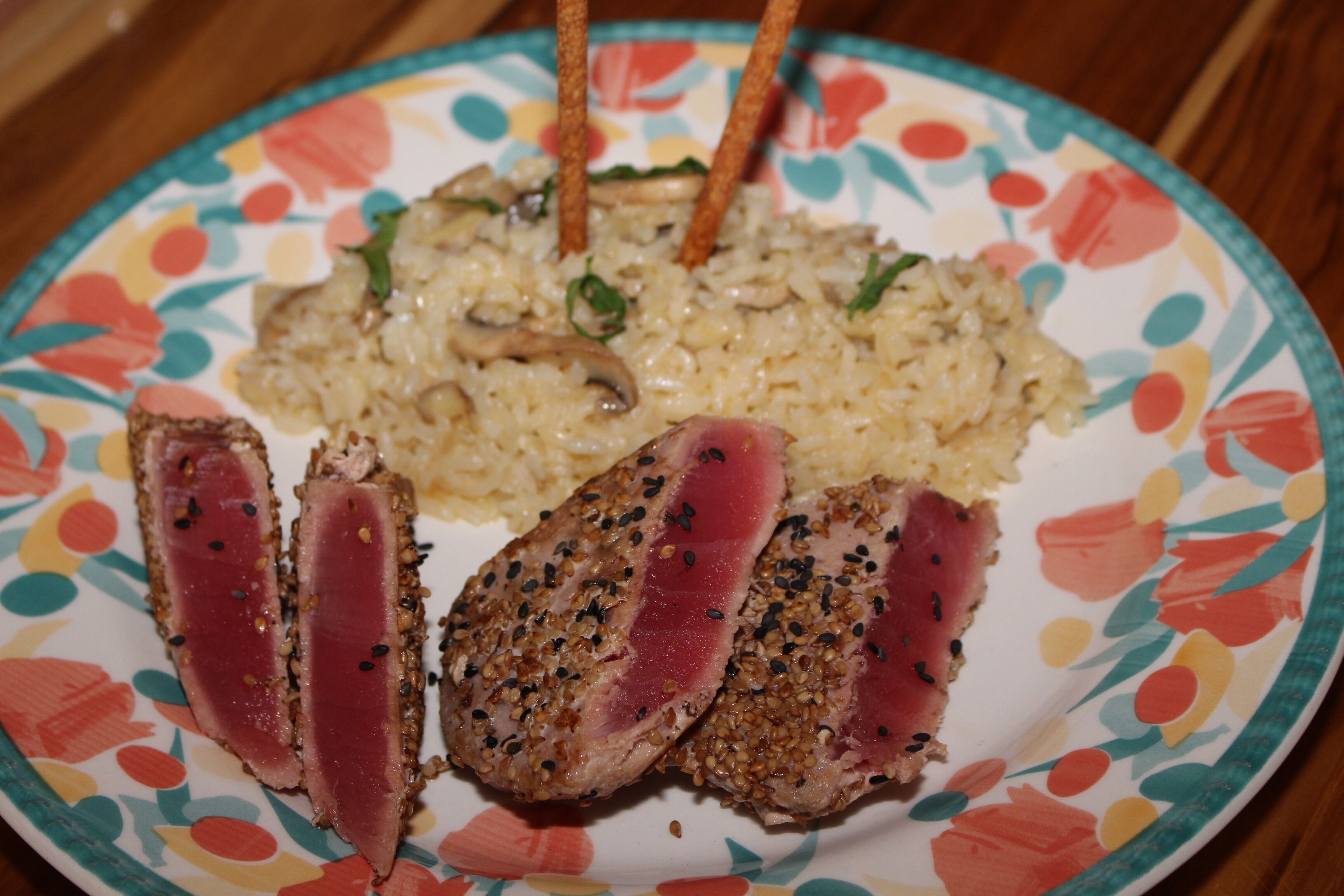 A plate with sliced meat and rice, possibly a meal.