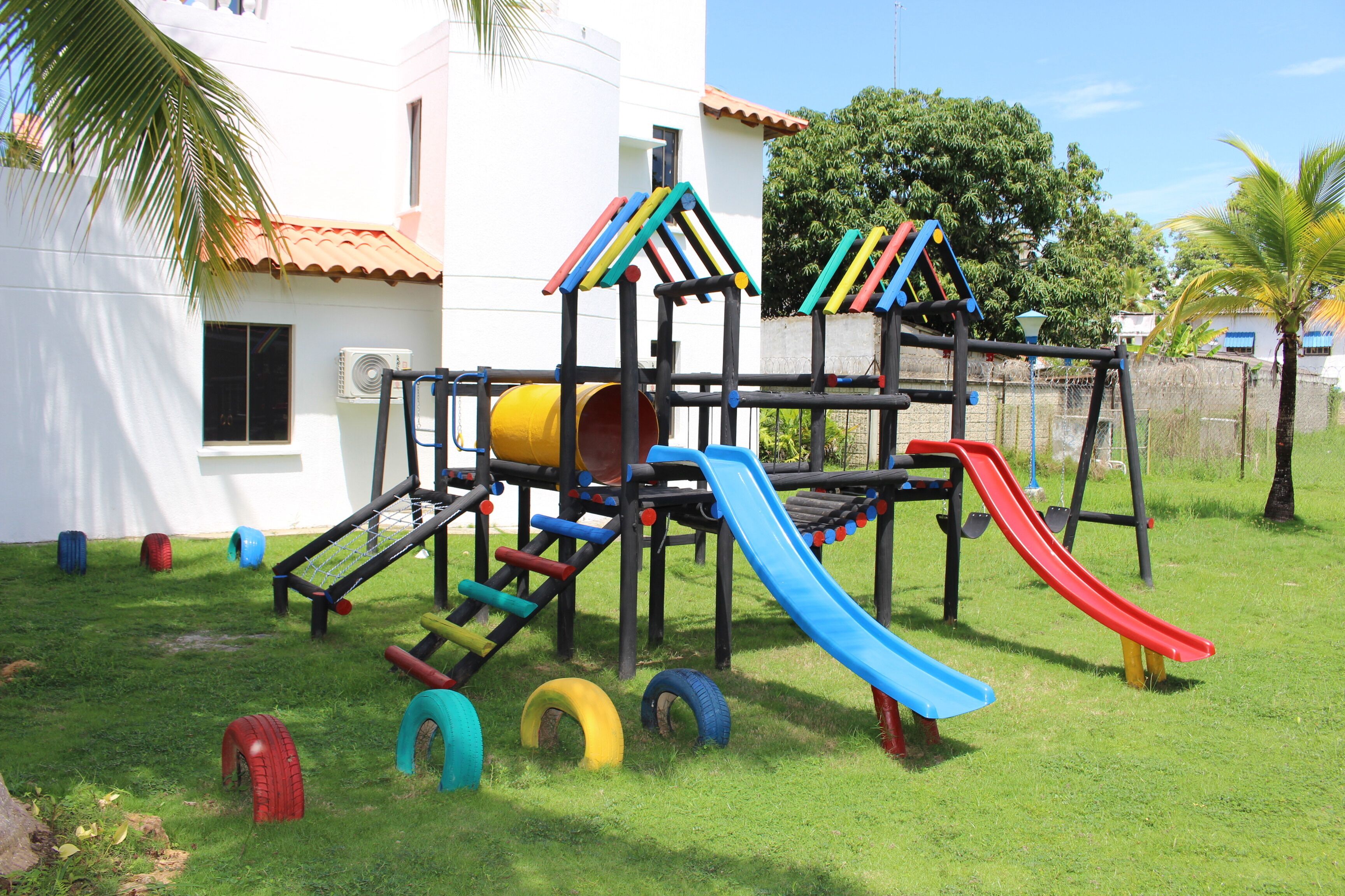 A playground with slides and climbing structures.