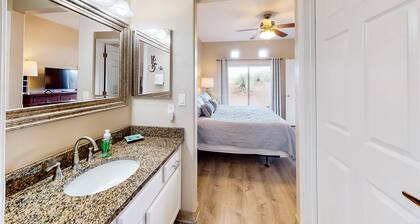 Dog-friendly, ground-floor condo with patio, desert views, pool, hot tub, & W/D
