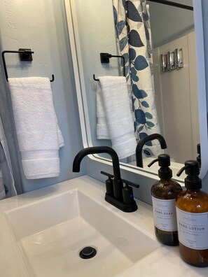 Shower, hair dryer, bathrobes, towels