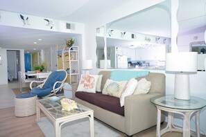 Living area - Comfortable, spacious 2 bedroom oceanfront condo with free WiFi, and a covered balcony with a wonderful ocean view located uptown just steps to the beach! (Ocean City)