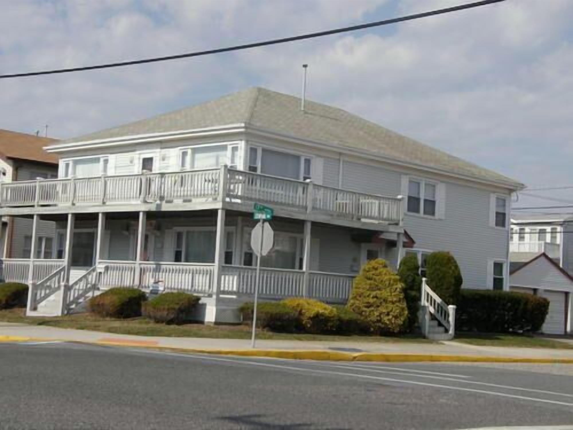 Welcome to the porch of this 4 bedroom, 2 bath condo, which is  just a short walk to the beach and boardwalk