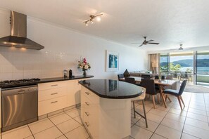 Fridge, stovetop, dishwasher, coffee/tea maker