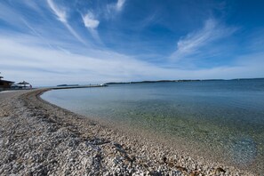 On the beach, sun loungers
