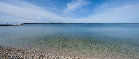 On the beach, sun-loungers