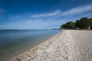 On the beach, sun loungers