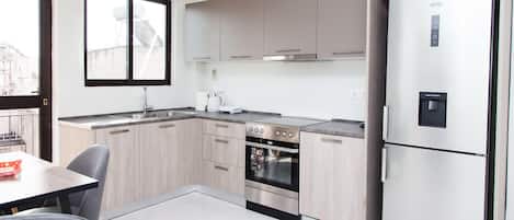 Apartment | Private kitchen | Full-size fridge, microwave, oven, stovetop