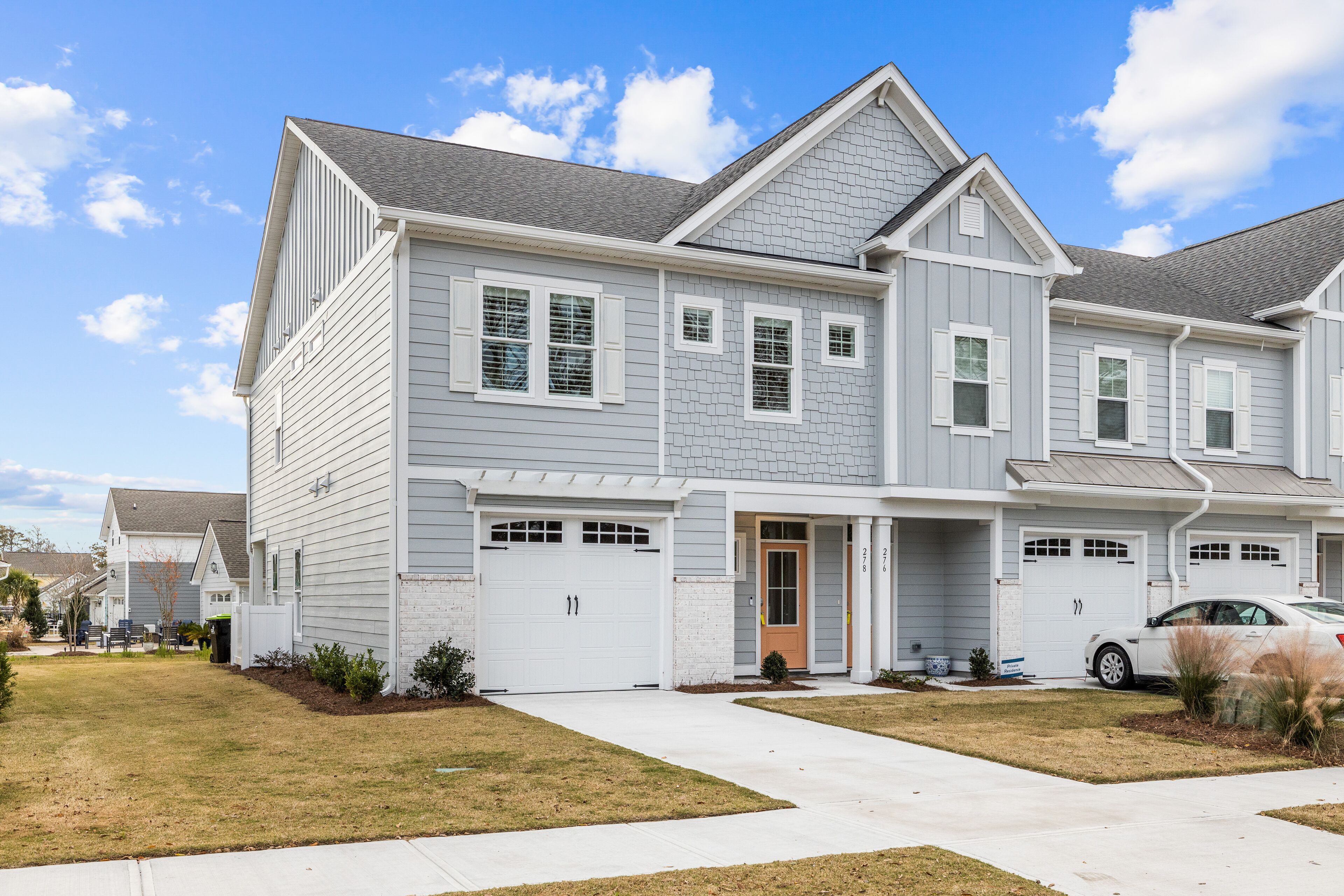 Coastal townhome with outdoor living, central AC, washer/dryer, & pool access
