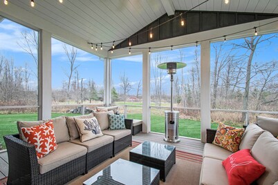 Modern home with large sun-room, firepit, grill, washer/dryer, & central AC
