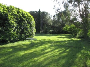 Enjoy a peaceful retreat amidst lush greenery and a serene outdoor setting.