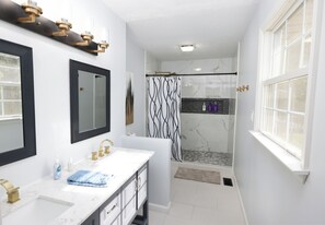 Shower, hair dryer, towels, shampoo