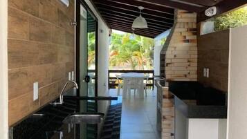 Apartamento premium | Área de estar | TV