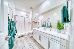 Shower, hair dryer, towels, soap