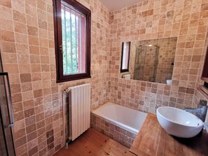 Shower, hair dryer, towels, toilet paper