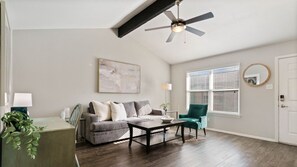 A spacious living room with a ceiling fan, a sofa set, a coffee table, and a dining area with a table and chairs. - Kinney #1 xxxxxxxxxx (Austin)