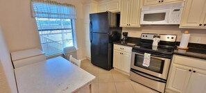 Condo, Multiple Beds, Kitchen | Private kitchen | Fridge, microwave, oven, stovetop