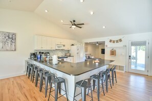 Fridge, stovetop, coffee/tea maker, dining tables