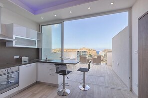 Apartment | Private kitchen | Fridge, microwave, oven, stovetop - Seafront Penthouse Triplex- Roof Terrace & Hot Tub (St. Julian's)