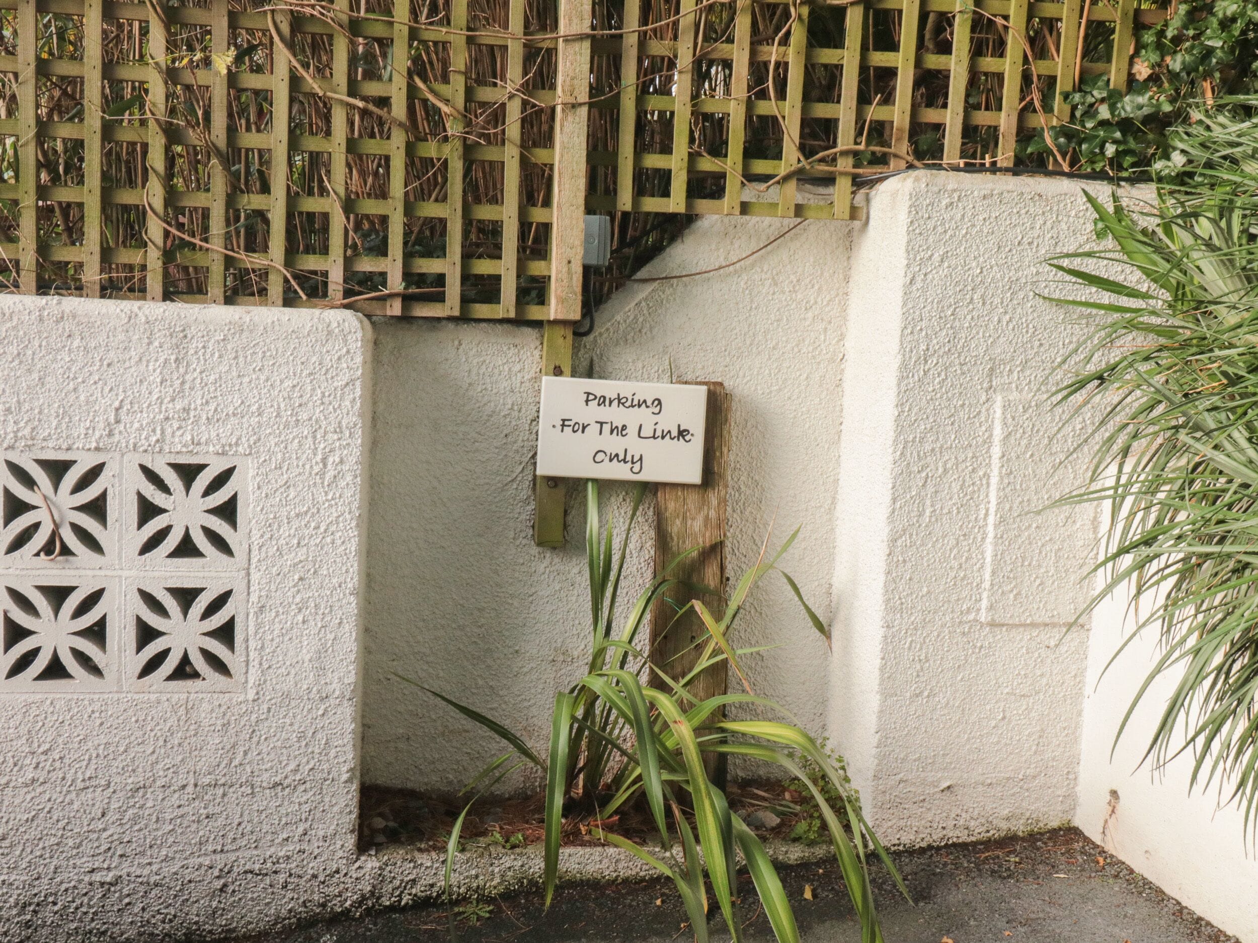 A sign indicating parking is for the Link only.