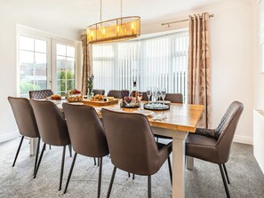 Dining - The open plan living area and interior design are a delight. (Bridlington)
