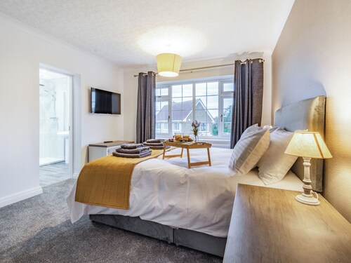 The open plan living area and interior design are a delight.