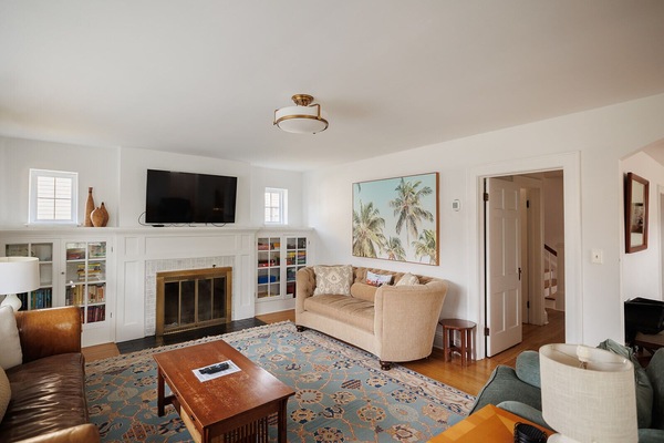 Bright and Sunny Living Room with 2 couches and 2 love seats. Smart TV and plenty of games for all!