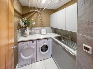 utility room with washer & dryer and airer | Cherry Cottage, Little Salkeld, near Penrith