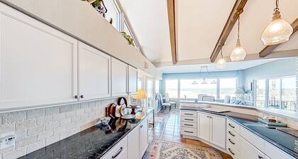 Spacious riverfront home with pool, patio, deck, & grill - great views