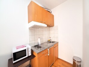 Fridge, microwave, cookware/dishes/utensils