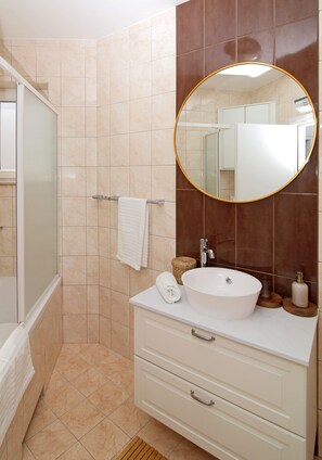 Bathtub, hair dryer, towels