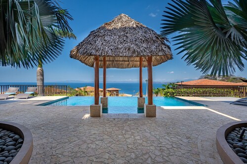 Exquisite ocean-view villa with pool, balcony, & central AC