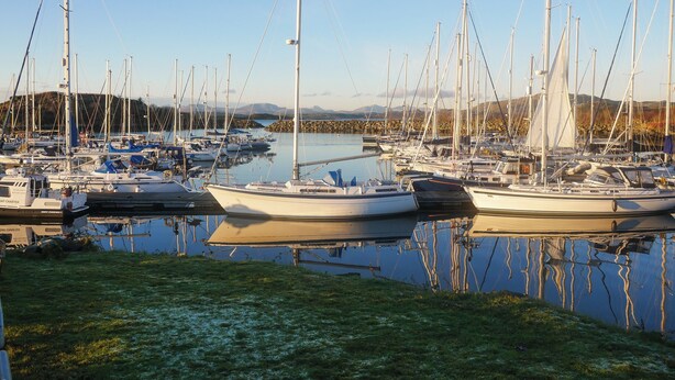 A marina with multiple sailboats docked. - Siskin Lodge - UK39664 (Craobh Haven)