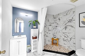 Shower, hair dryer, towels, soap