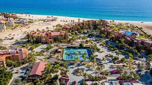 A resort with multiple buildings, a central pool area, and a beach. - Casa Del Mar Las Olas 301 Beachfront 2BR Penthouse (San Jose del Cabo)